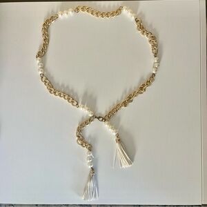 Gold chain and pearl waist belt with leather tassels